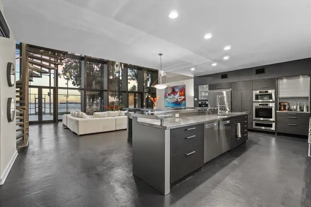 a view of a living room with floor to ceiling windows and floor to ceiling window