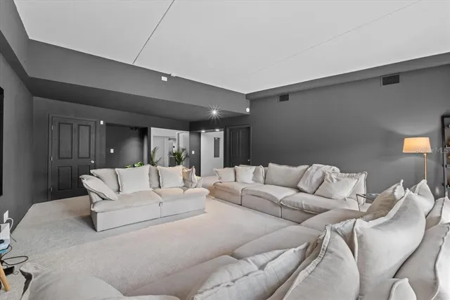 a bedroom with a bed and a potted plant