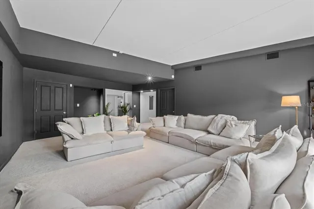 a spacious bedroom with a bed and a window