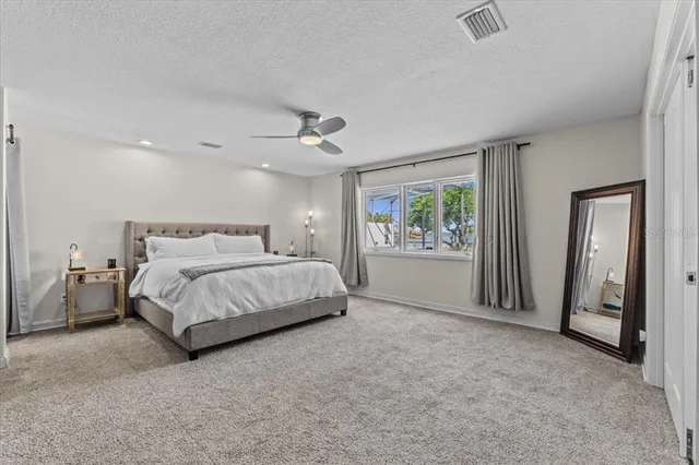 a kitchen with stainless steel appliances granite countertop a sink a stove and a refrigerator