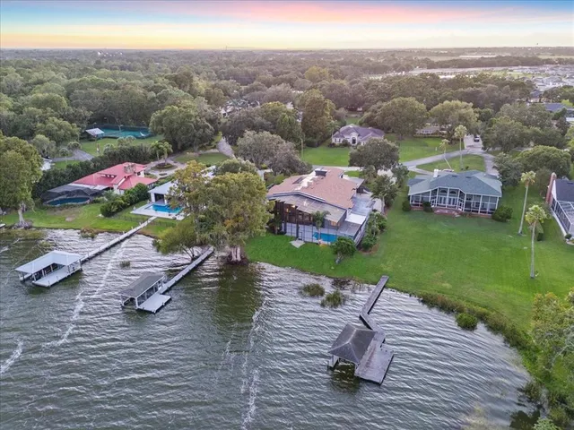a living room with furniture a rug and a chandelier