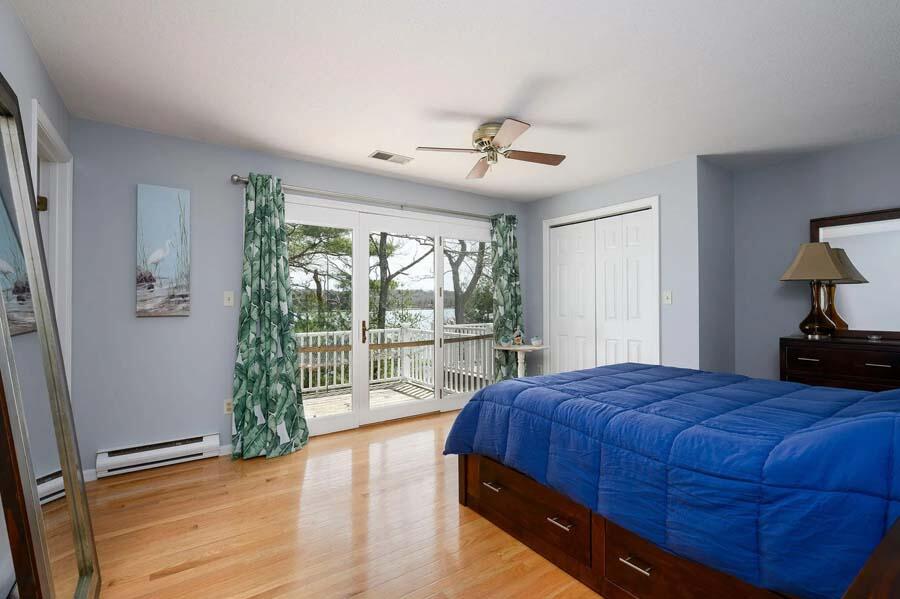 14 Arnold Road Forestdale, MA 02644 - Photo 19 of 43 a bedroom with a large bed and a window