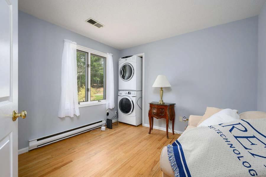 14 Arnold Road Forestdale, MA 02644 - Photo 21 of 43 a bedroom with a bed and a chair