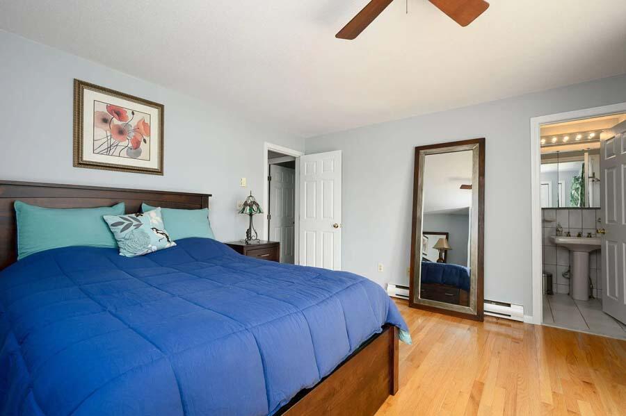 14 Arnold Road Forestdale, MA 02644 - Photo 28 of 43 a bedroom with a bed and a chandelier