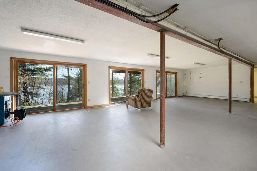 14 Arnold Road Forestdale, MA 02644 - Photo 32 of 43 a view of a room with gym equipment and large windows