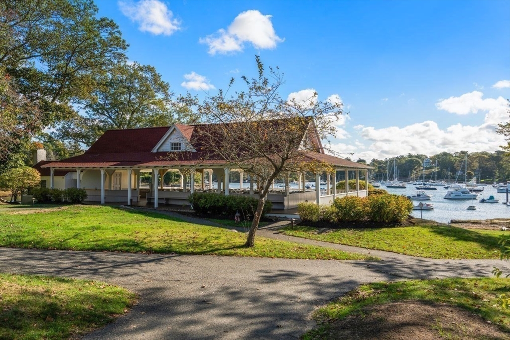 6 Highland Avenue Manchester, MA 01944 - Photo 13 of 17 a front view of a house with a garden and trees