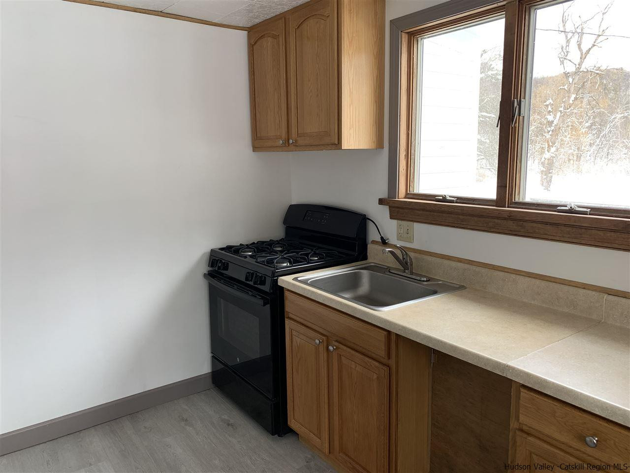 205 Union Center Road Ulster Park, NY 12487 - Photo 11 of 25 a view of a kitchen with a sink and cabinets