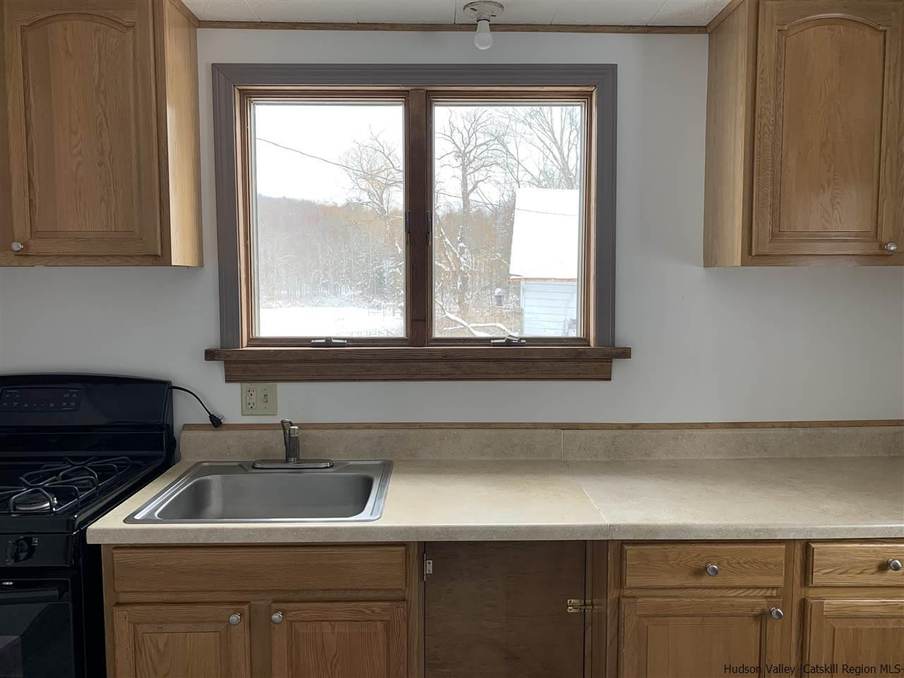 205 Union Center Road Ulster Park, NY 12487 - Photo 12 of 25 a kitchen with a sink and a window
