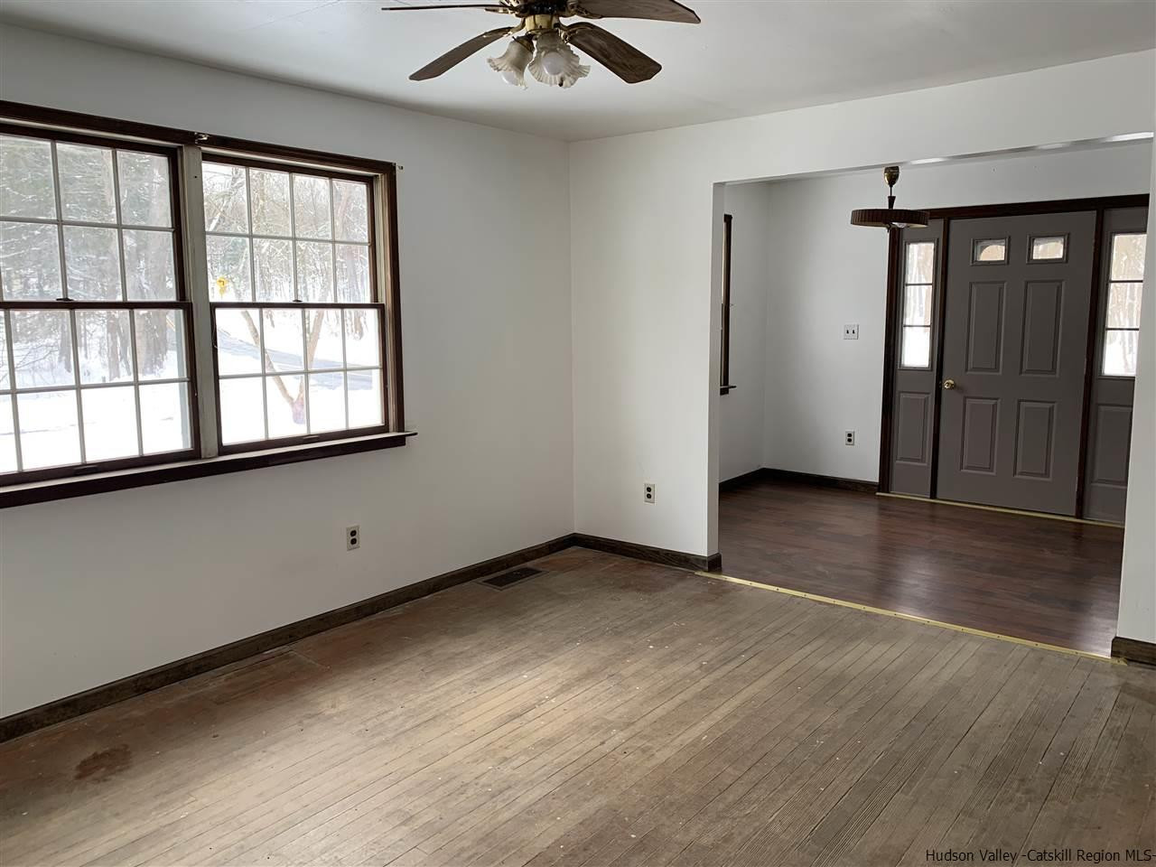 205 Union Center Road Ulster Park, NY 12487 - Photo 13 of 25 an empty room with wooden floor and windows