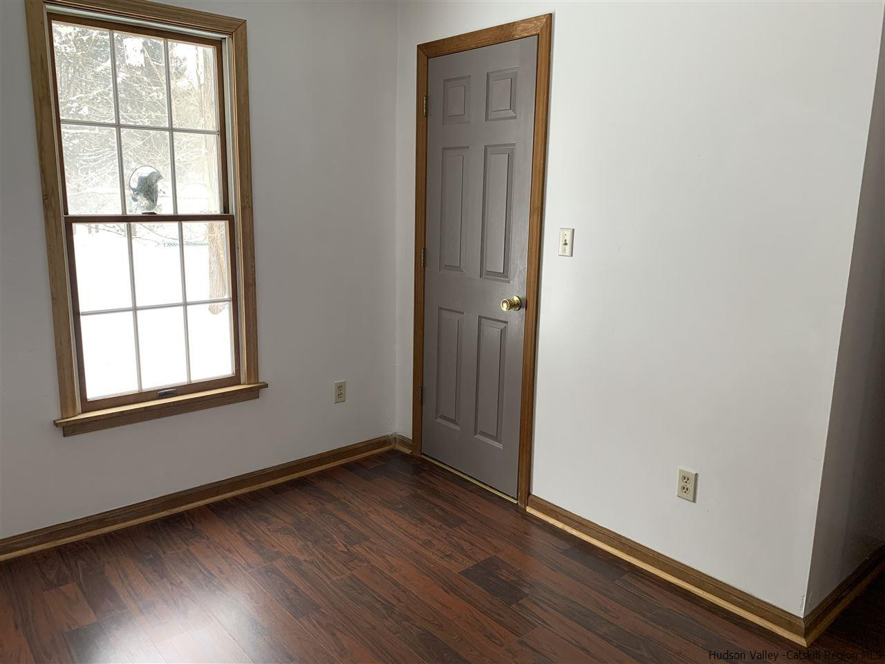 205 Union Center Road Ulster Park, NY 12487 - Photo 19 of 25 an empty room with wooden floor and windows