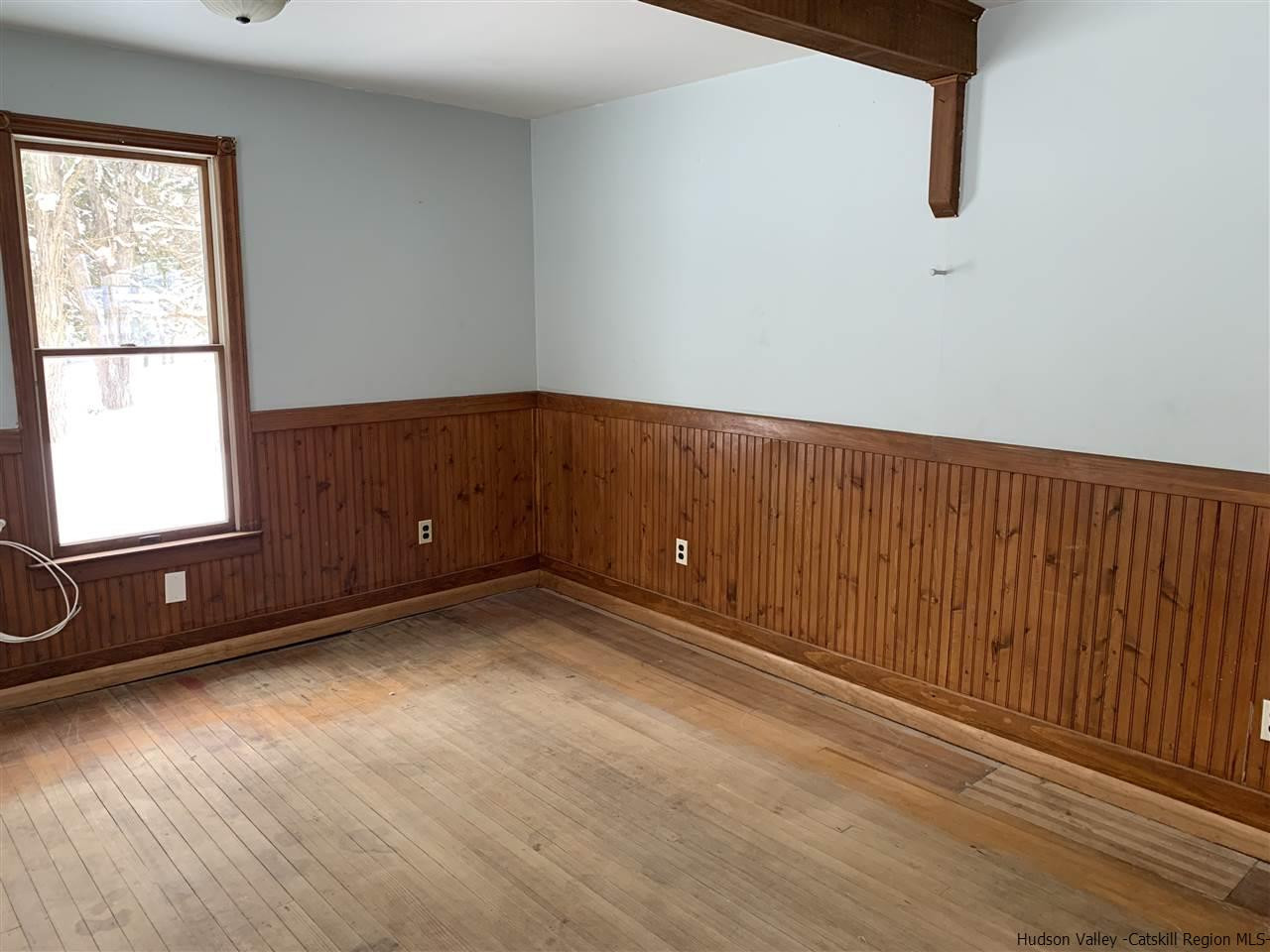205 Union Center Road Ulster Park, NY 12487 - Photo 3 of 25 a view of an empty room with wooden floor