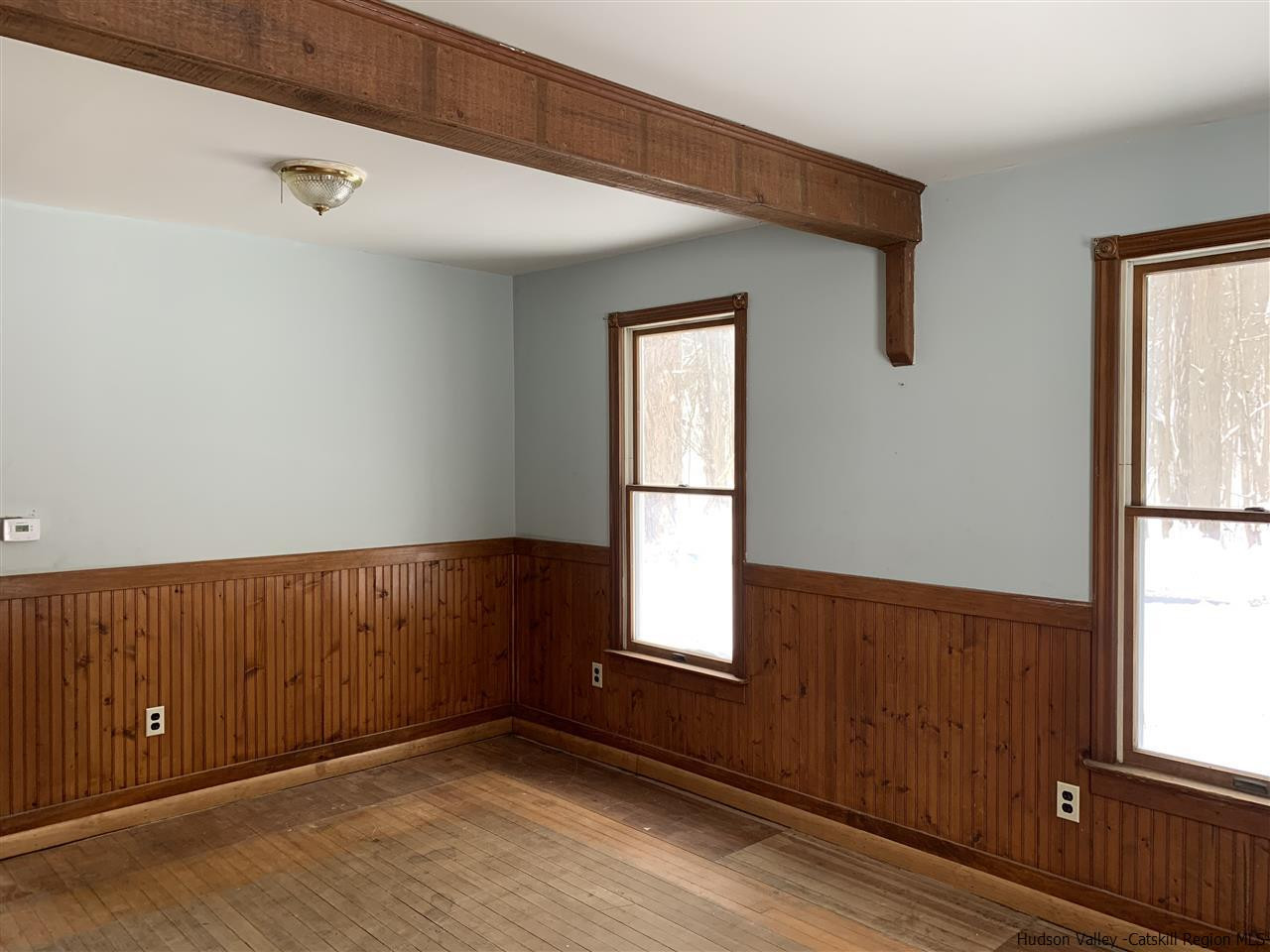 205 Union Center Road Ulster Park, NY 12487 - Photo 4 of 25 a view of an empty room with wooden floor and a window
