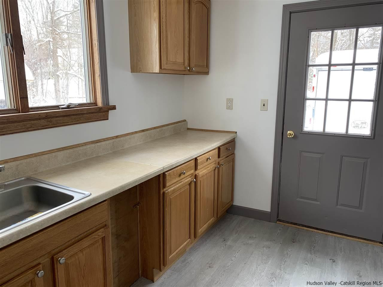 205 Union Center Road Ulster Park, NY 12487 - Photo 10 of 25 a kitchen with a sink and cabinets