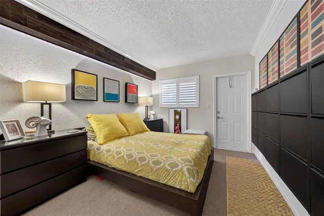 a bedroom with a bed and a walk in closet