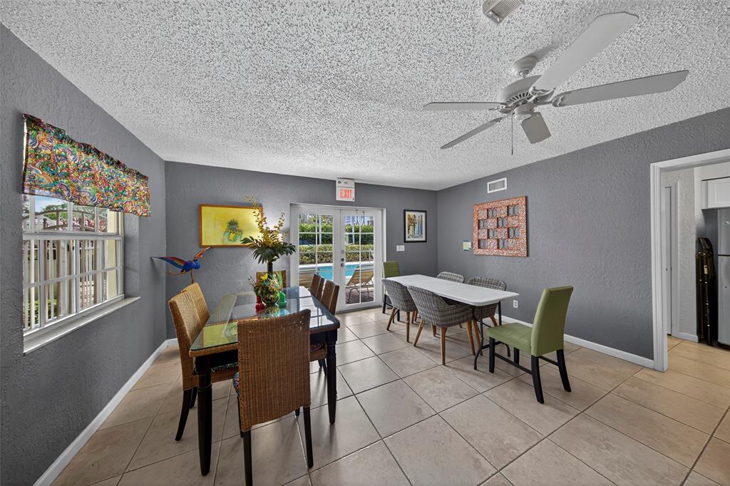 2660 Northeast 8th Avenue, Unit 208 Wilton Manors, FL 33334 - Photo 29 of 49 a view of a dining room with furniture window and outside view