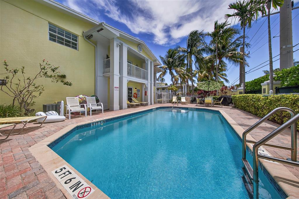 2660 Northeast 8th Avenue, Unit 208 Wilton Manors, FL 33334 - Photo 30 of 49 a view of swimming pool with outdoor seating