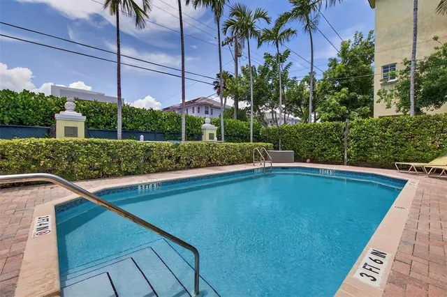a view of a swimming pool with a patio