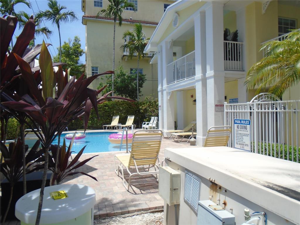 2660 Northeast 8th Avenue, Unit 208 Wilton Manors, FL 33334 - Photo 32 of 49 a view of a swimming pool with a patio