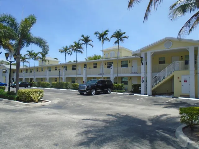 a view of a street with a building in the background
