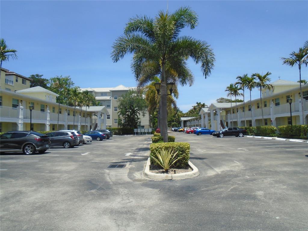 2660 Northeast 8th Avenue, Unit 208 Wilton Manors, FL 33334 - Photo 40 of 49 a view of a street with a building in the background