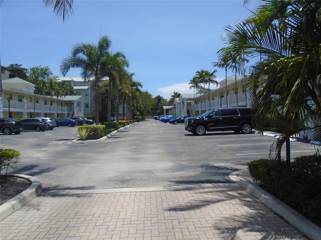 2660 Northeast 8th Avenue, Unit 208 Wilton Manors, FL 33334 - Photo 41 of 49 a car parked on the side of a street