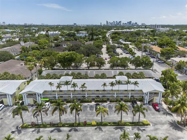 an aerial view of residential houses with outdoor space