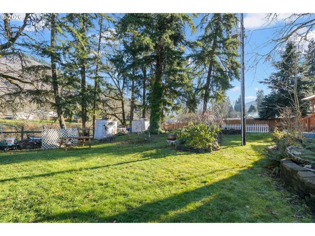 a view of a backyard with sitting area