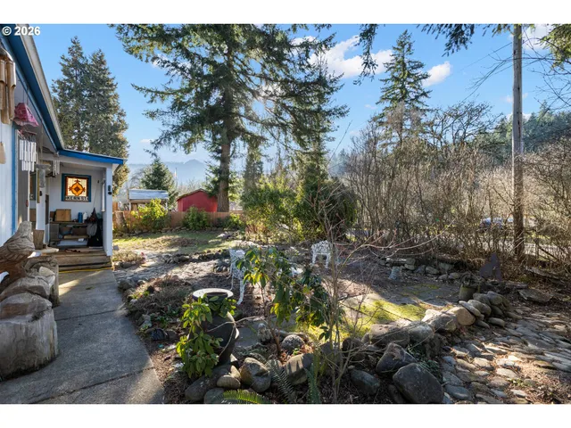 a view of backyard with a patio