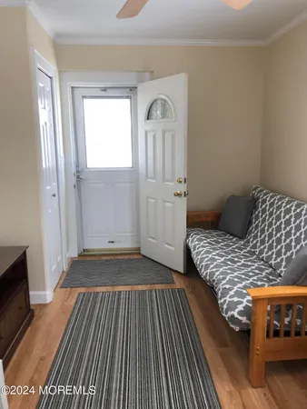 a view of kitchen and wooden floor