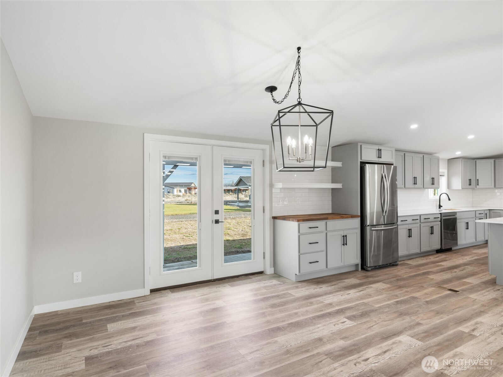 734 Lakeside Way Mattawa, WA 99349 - Photo 10 of 34 a kitchen with stainless steel appliances a stove top oven and refrigerator