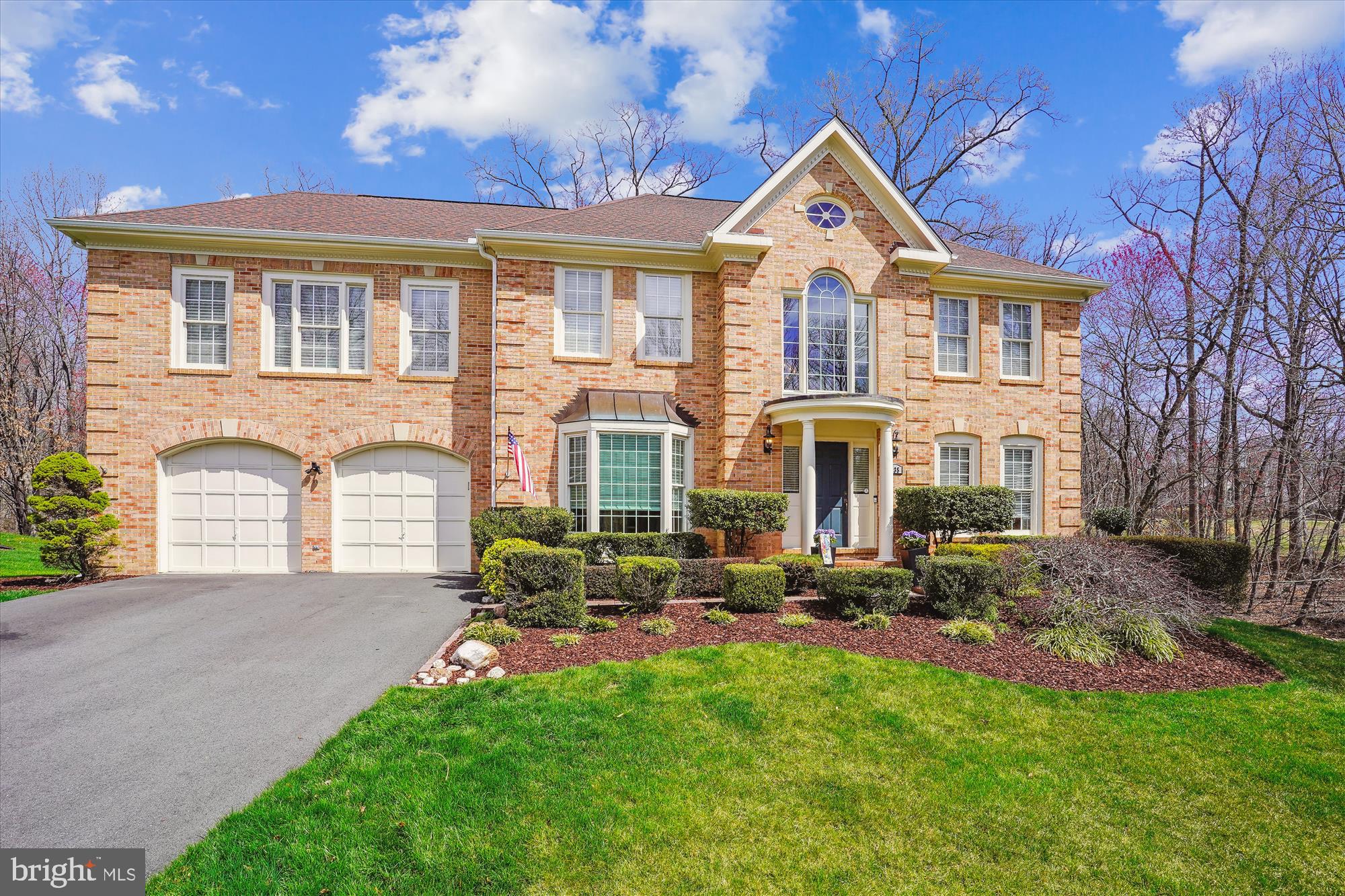 8535 Oak Chase Circle Fairfax Station, VA 22039 - Photo 1 of 62 a front view of a house with a garden and plants