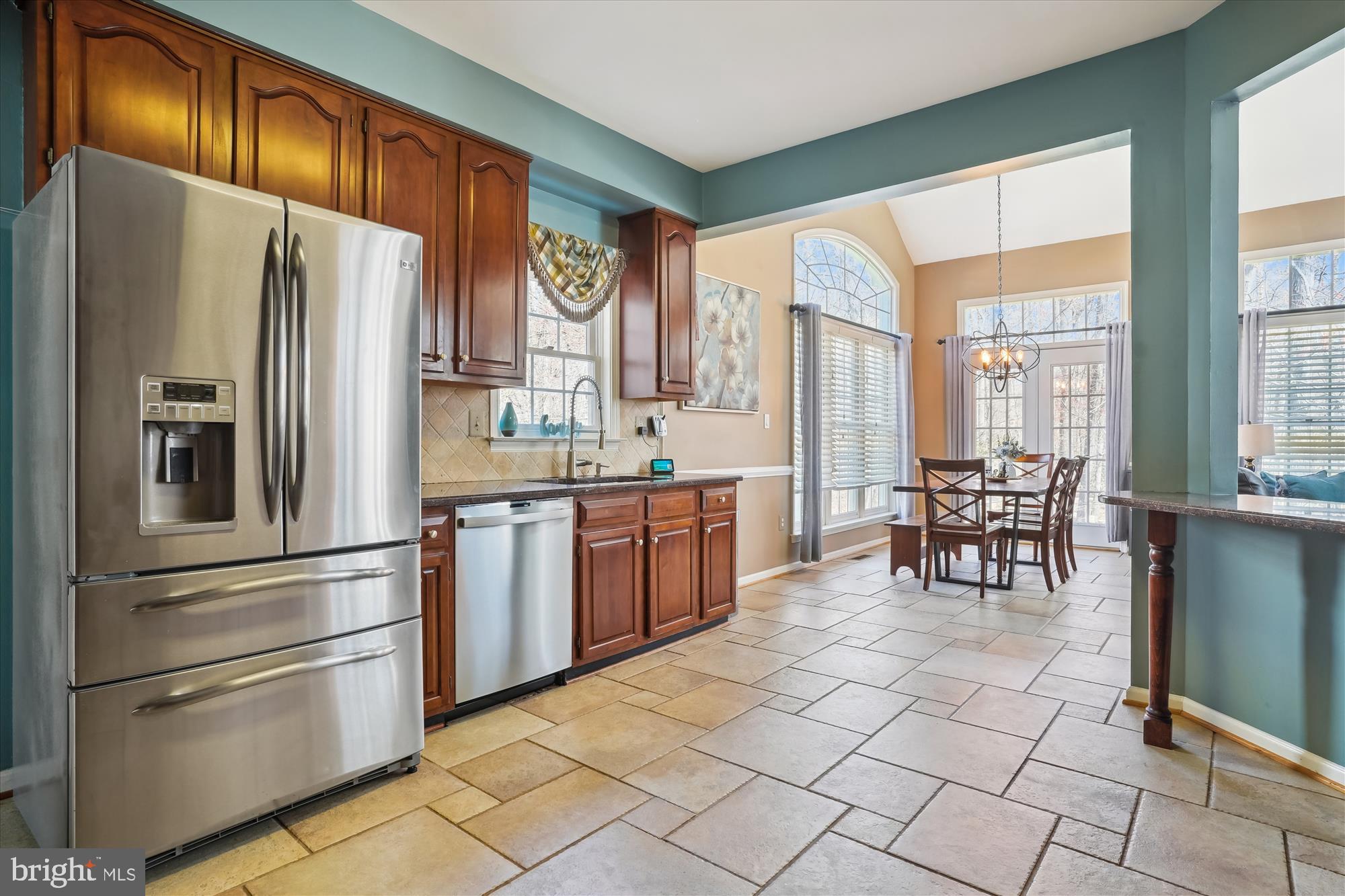 8535 Oak Chase Circle Fairfax Station, VA 22039 - Photo 11 of 62 a kitchen with stainless steel appliances a refrigerator and a stove