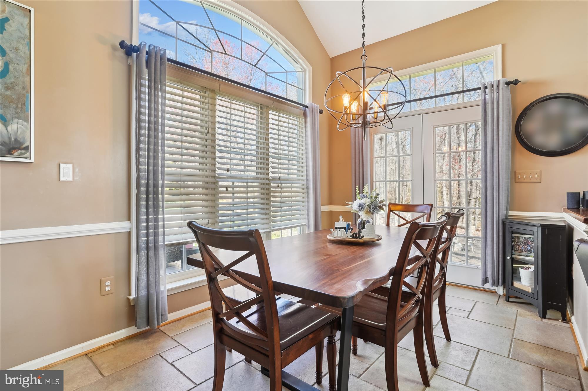 8535 Oak Chase Circle Fairfax Station, VA 22039 - Photo 12 of 62 a view of a dining room with furniture and chandelier