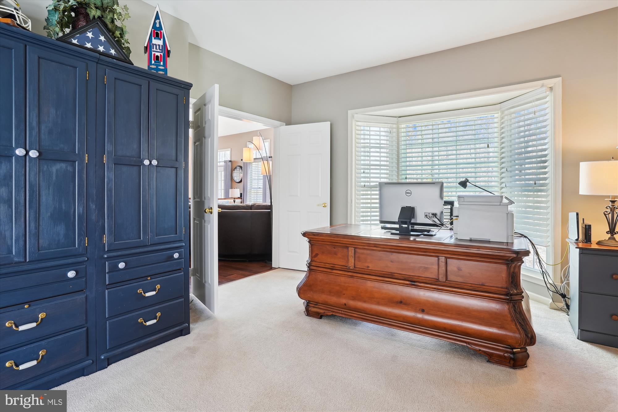 8535 Oak Chase Circle Fairfax Station, VA 22039 - Photo 14 of 62 a spacious bedroom with a dresser and a window