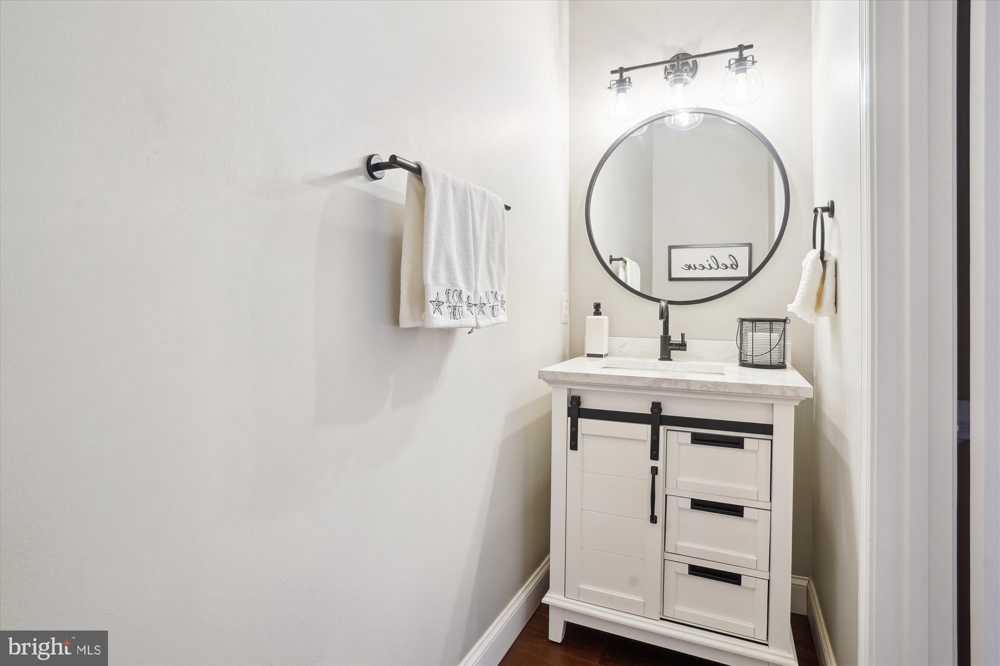 8535 Oak Chase Circle Fairfax Station, VA 22039 - Photo 23 of 62 a bathroom with a sink and a mirror