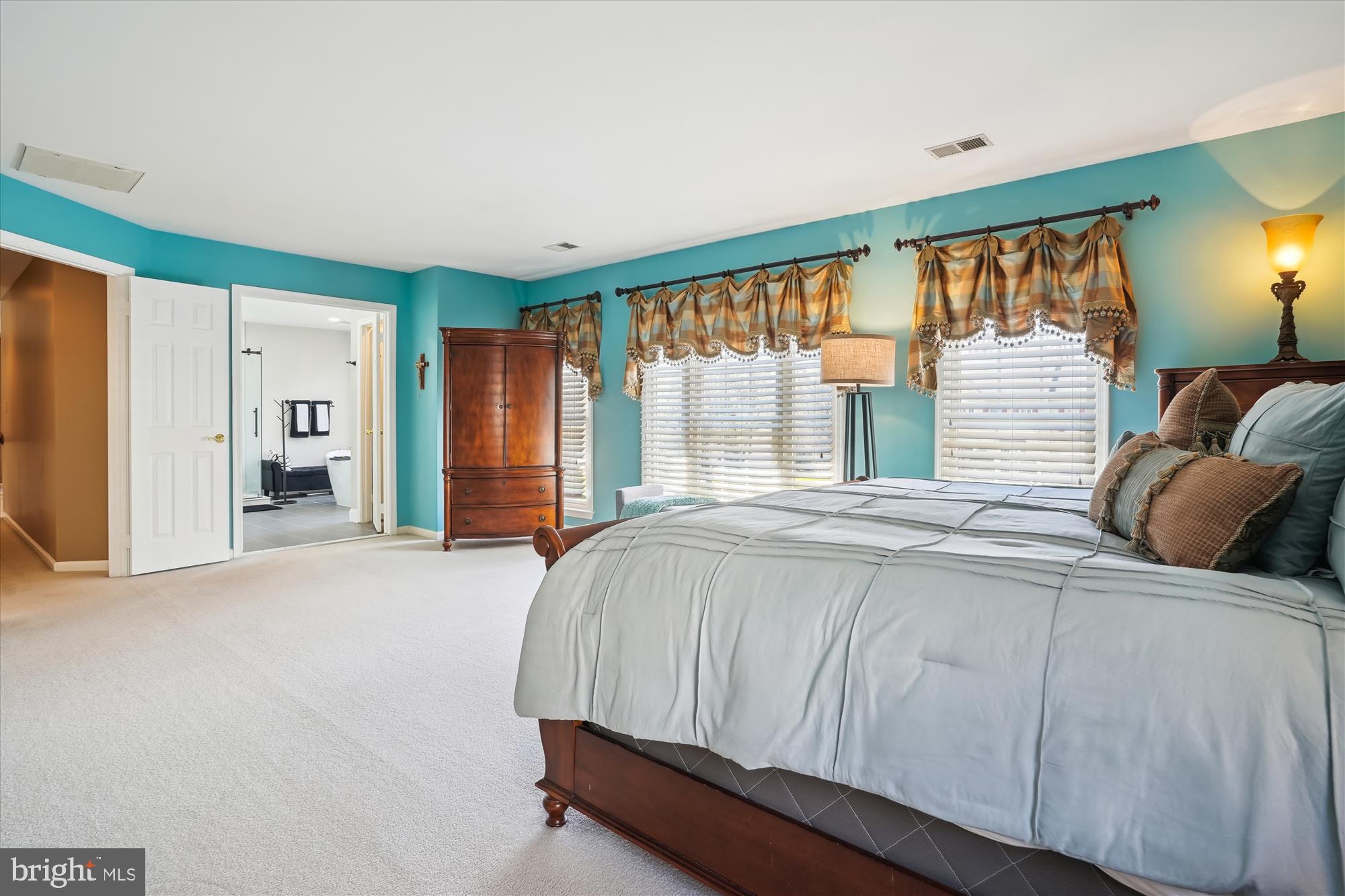 8535 Oak Chase Circle Fairfax Station, VA 22039 - Photo 31 of 62 a bedroom with a bed and a large window
