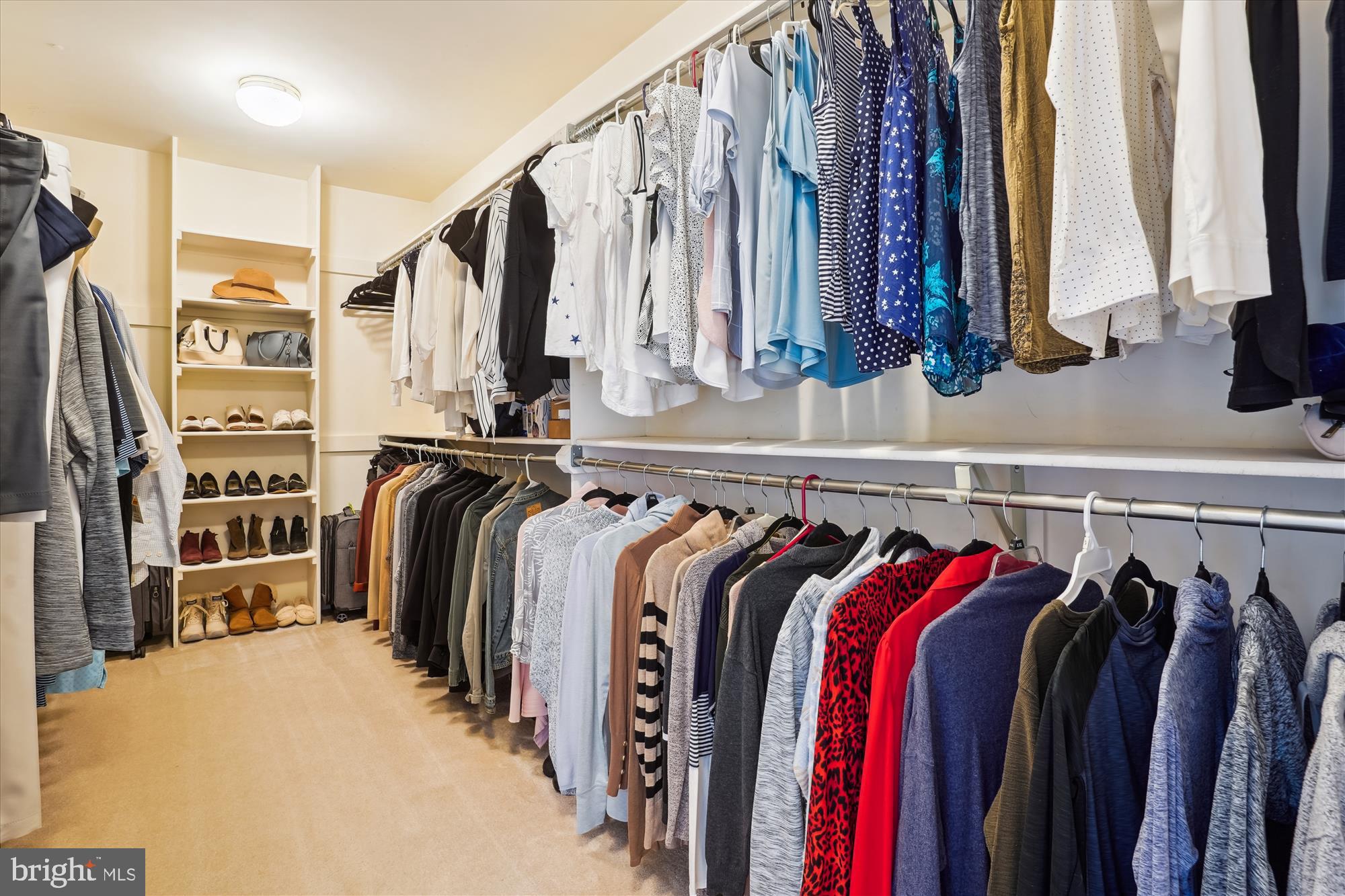 8535 Oak Chase Circle Fairfax Station, VA 22039 - Photo 32 of 62 a view of walk in closet with clothes and shoes