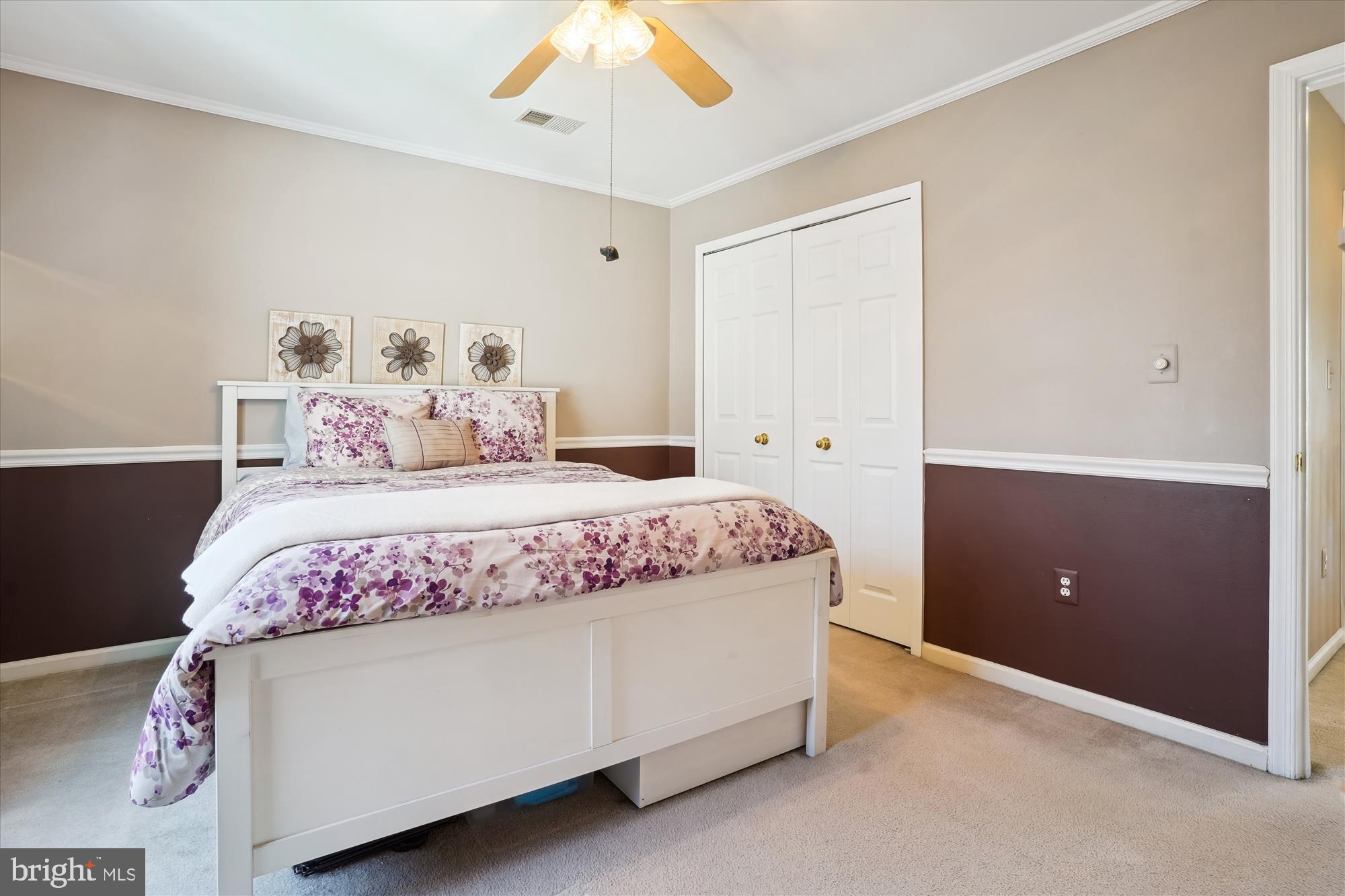 8535 Oak Chase Circle Fairfax Station, VA 22039 - Photo 38 of 62 a bedroom with a bed and a chandelier