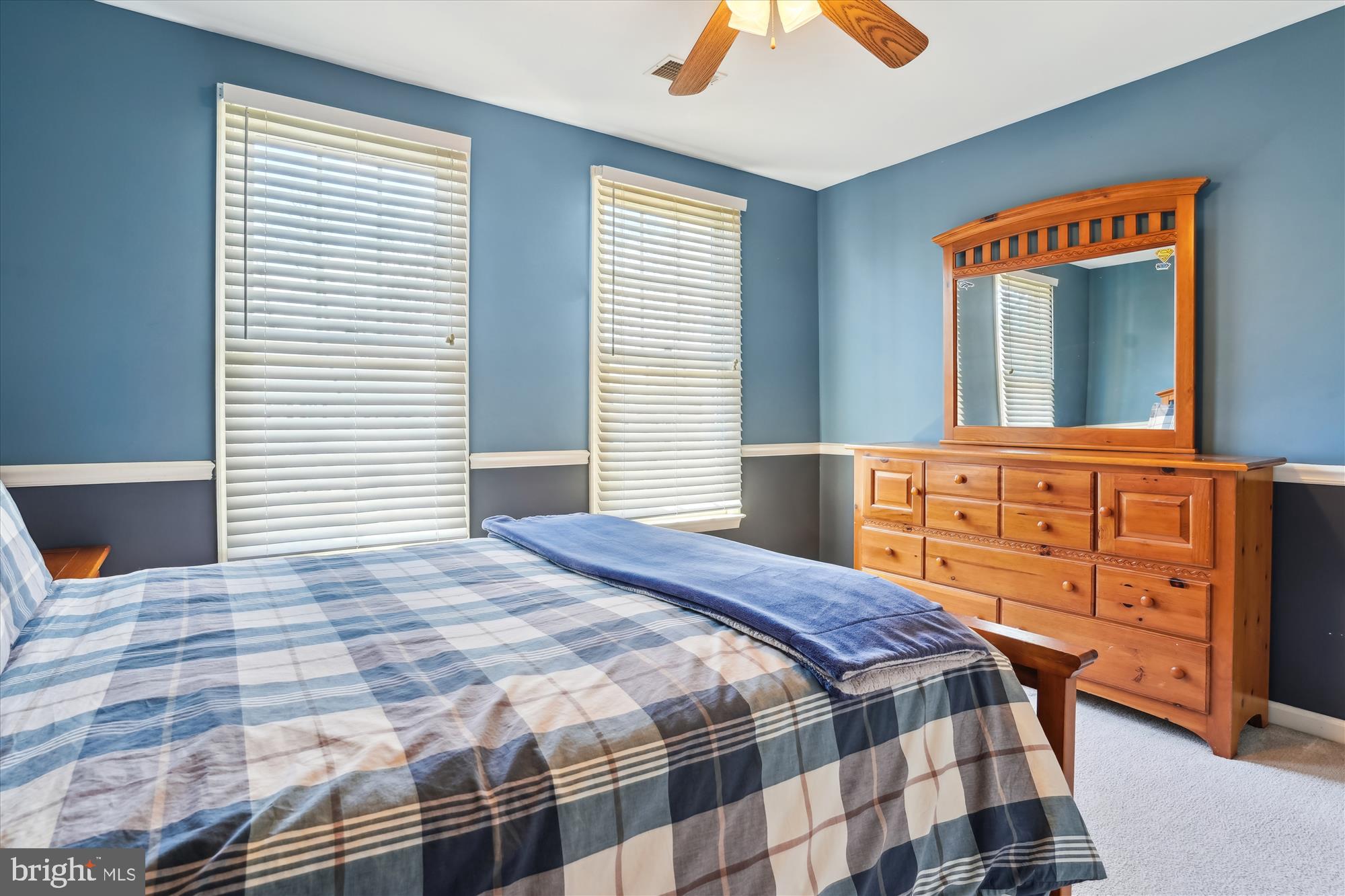 8535 Oak Chase Circle Fairfax Station, VA 22039 - Photo 41 of 62 a bedroom with a bed and wooden floor