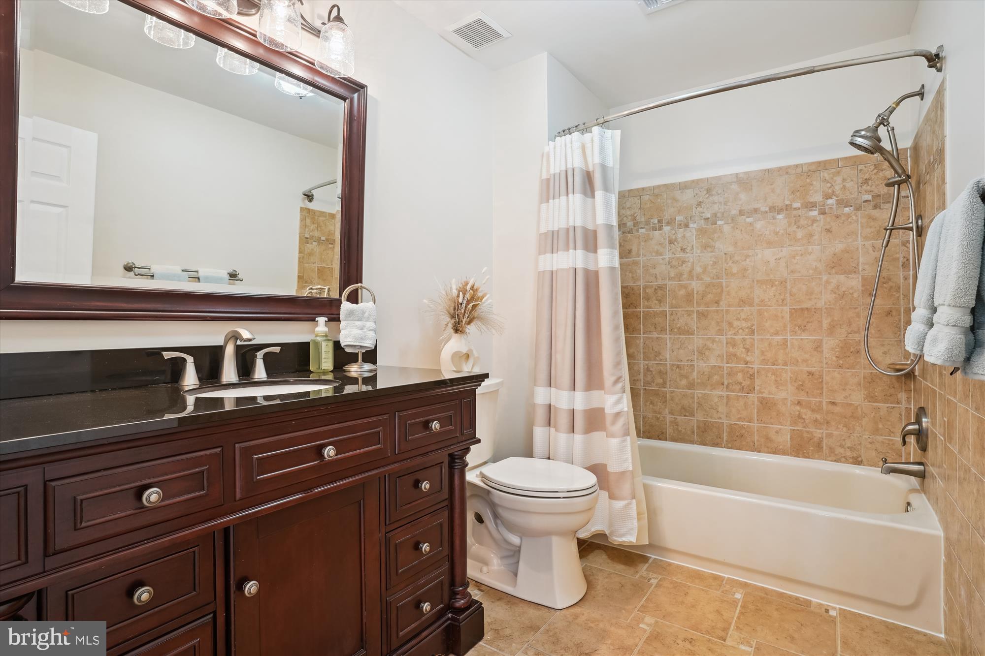 8535 Oak Chase Circle Fairfax Station, VA 22039 - Photo 44 of 62 a bathroom with a bathtub shower sink vanity and toilet