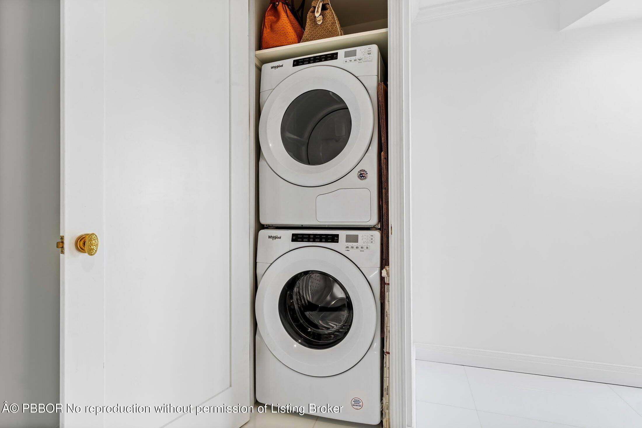 44 Cocoanut Row, Unit 526B Palm Beach, FL 33480 - Photo 17 of 33 a utility room with dryer and washer