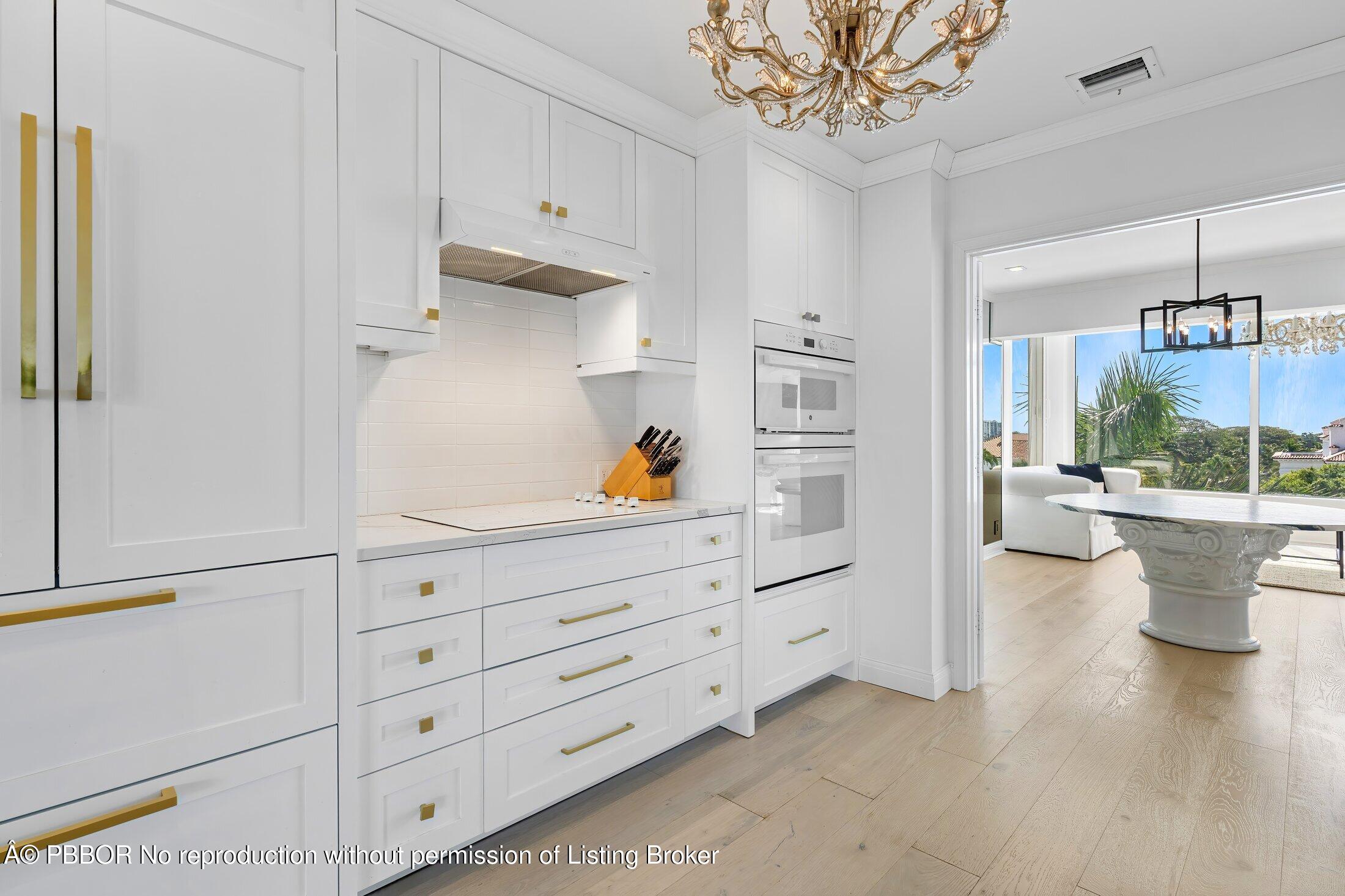 44 Cocoanut Row, Unit 526B Palm Beach, FL 33480 - Photo 5 of 33 a kitchen view white cabinets and stainless steel appliances