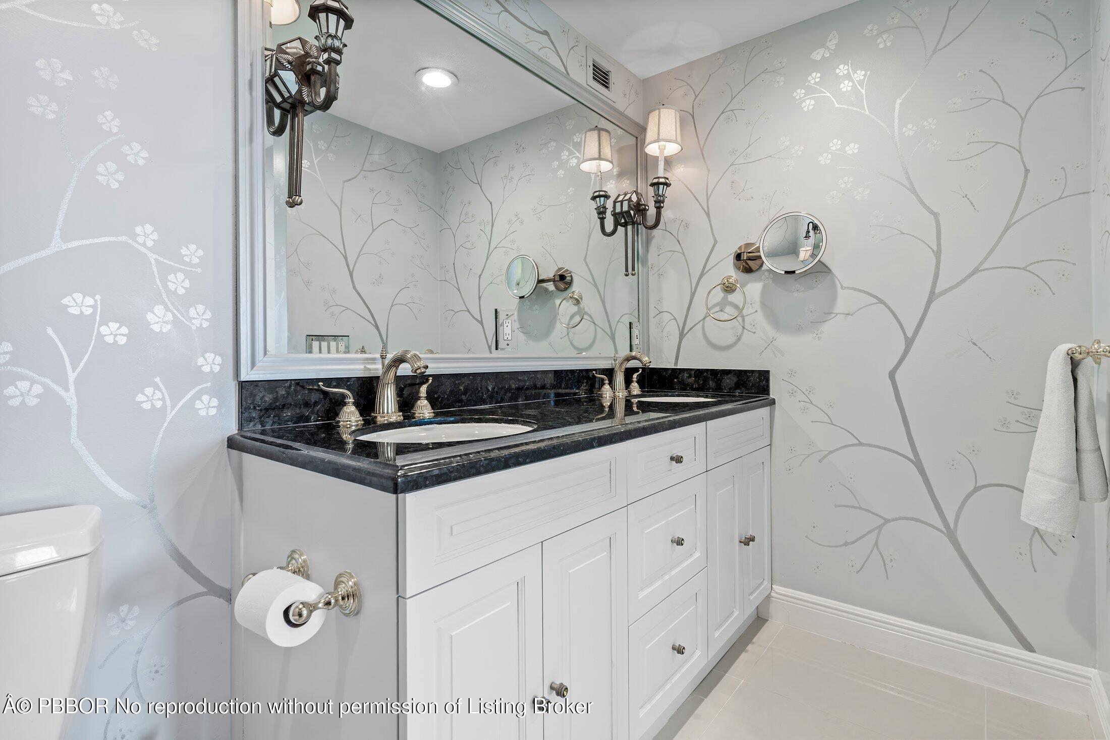 44 Cocoanut Row, Unit 526B Palm Beach, FL 33480 - Photo 10 of 33 a close view of a sink a faucet a light fixture and a granite counter top