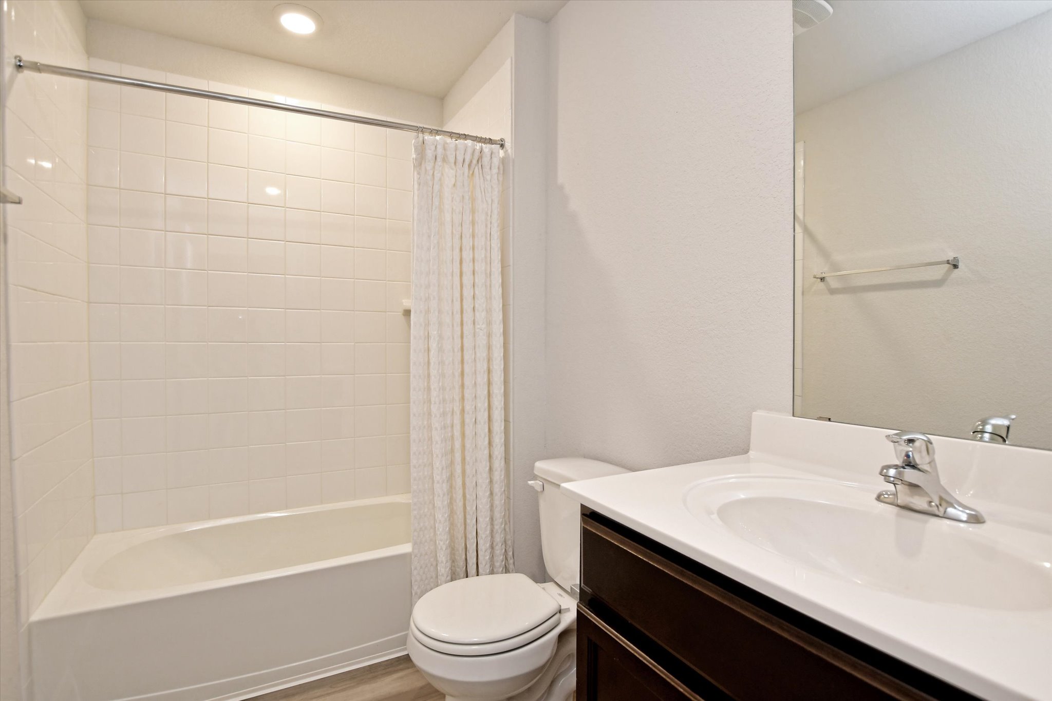 508 Wyatt Way Jarrell, TX 76537 - Photo 16 of 27 Guest bath offers a tub/shower combo and dark cabinets contrasting the white time