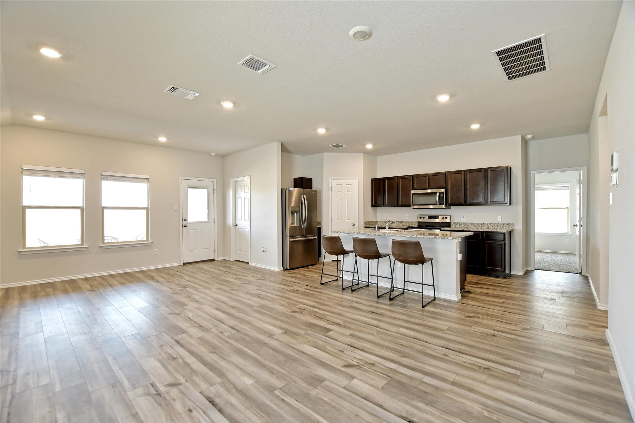 508 Wyatt Way Jarrell, TX 76537 - Photo 5 of 27 Pull up a seat to this island transforming the space to a conversation starter.