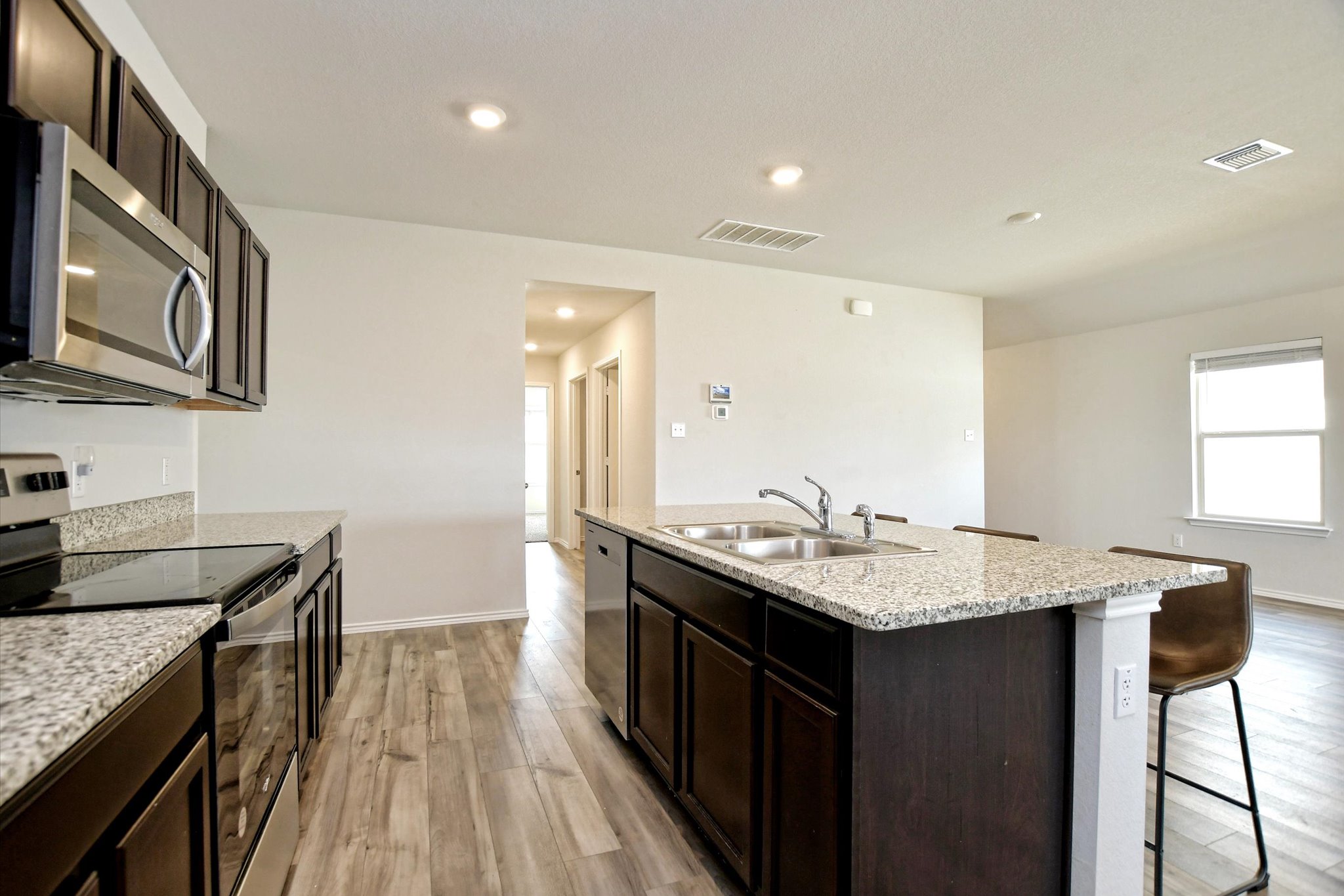 508 Wyatt Way Jarrell, TX 76537 - Photo 9 of 27 Built in microwave and stone countertop are added features