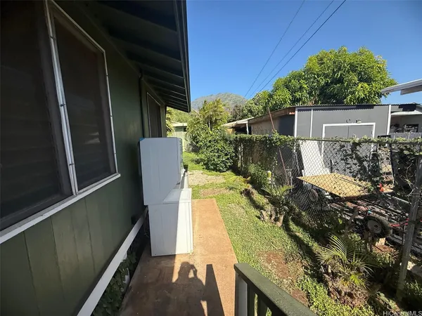 a view of balcony with wooden floor and a potted plant