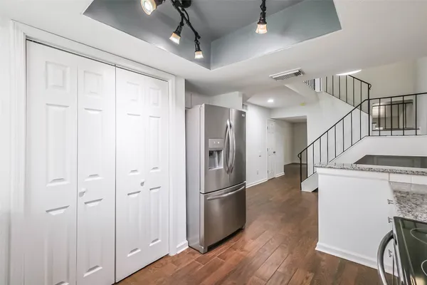 a view of entryway with wooden floor