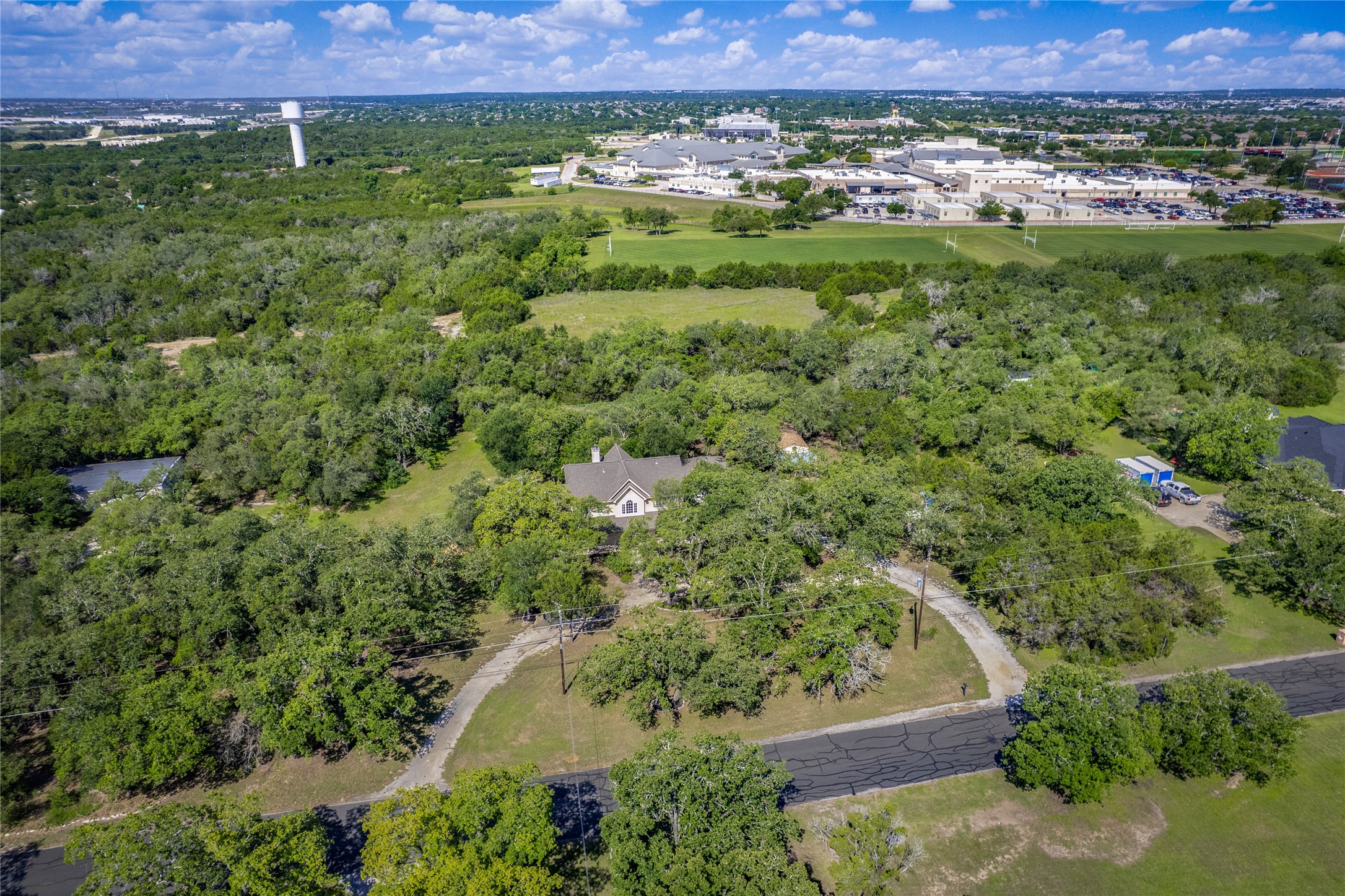613 Breakaway Road Cedar Park, TX 78613 - Photo 39 of 40 a view of a lush green field with lots of plants in it