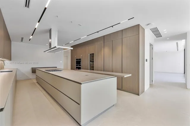 a bathroom with a walk in closet and mirror
